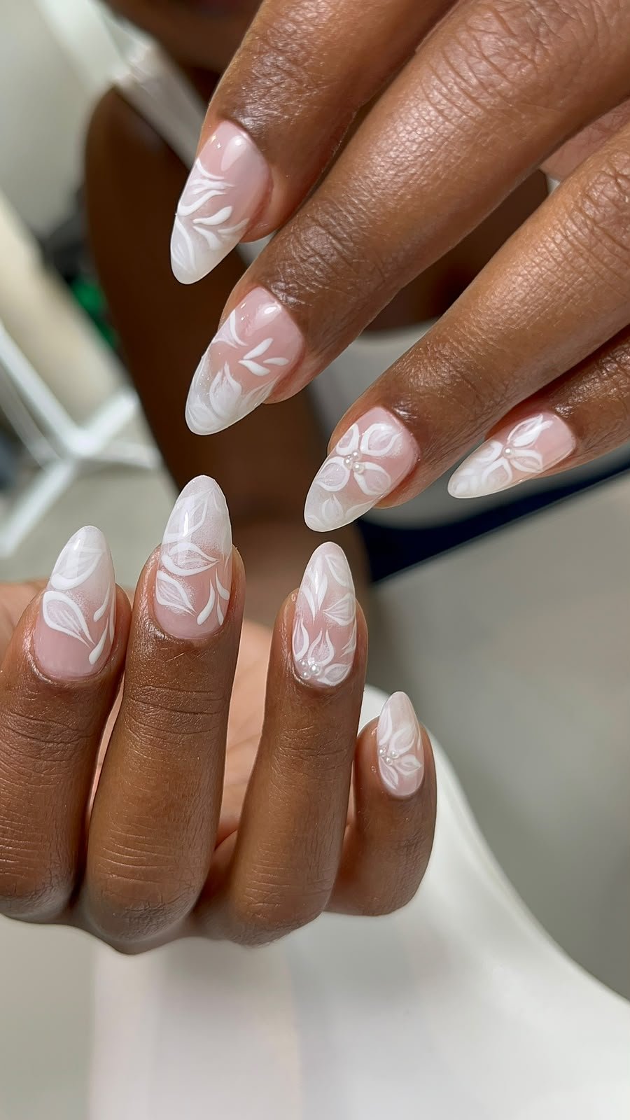 Olive toned manicure photographed in a Mediterranean setting