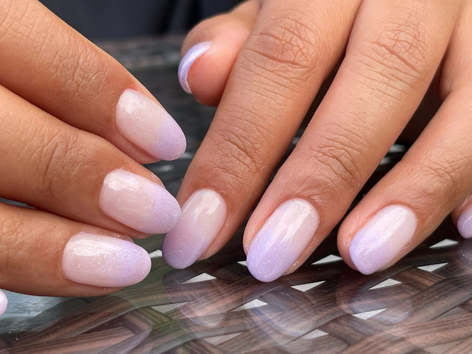 Lilac manicure photographed in a refined editorial setting